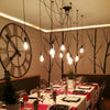 black industrial Chandelier dining table decor 